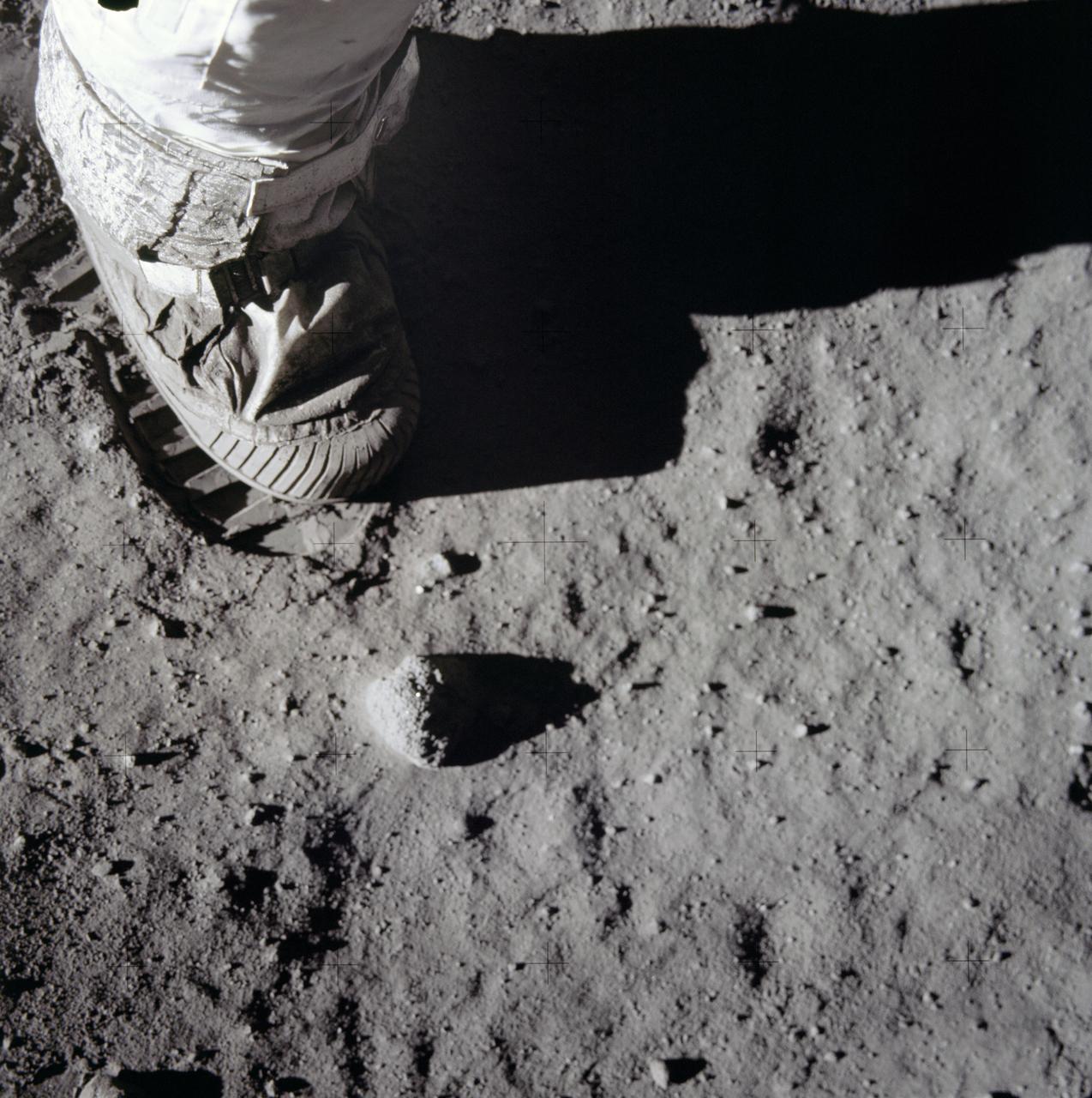 Close-up of an astronaut's boot and its print in grey lunar soil